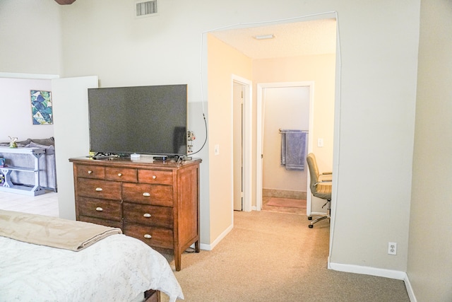 bedroom featuring light colored carpet