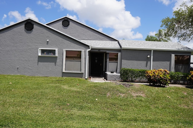 exterior space with a front lawn