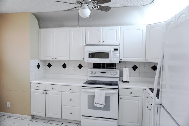 kitchen featuring white appliances, decorative backsplash, white cabinets, ceiling fan, and light tile patterned flooring