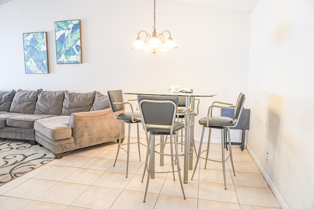 tiled dining space with vaulted ceiling and an inviting chandelier