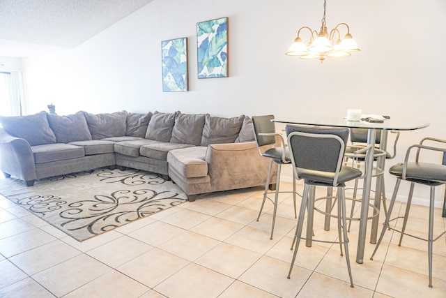 living room featuring vaulted ceiling, a textured ceiling, light tile patterned floors, and a chandelier