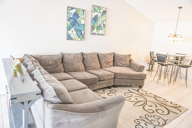 tiled living room with high vaulted ceiling and a chandelier