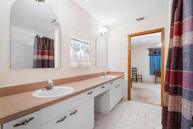 bathroom with vanity and tile patterned floors