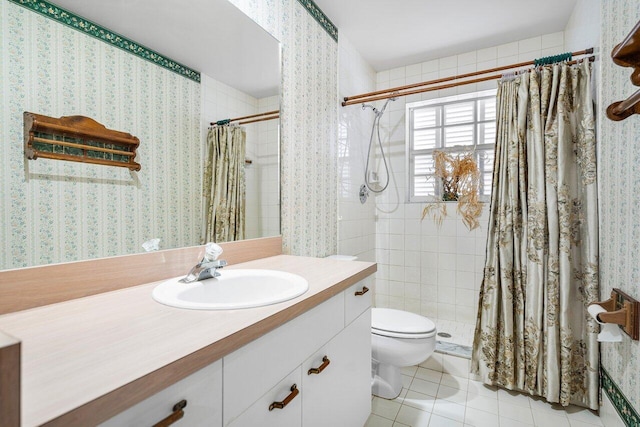 bathroom with vanity, tile patterned floors, toilet, and walk in shower