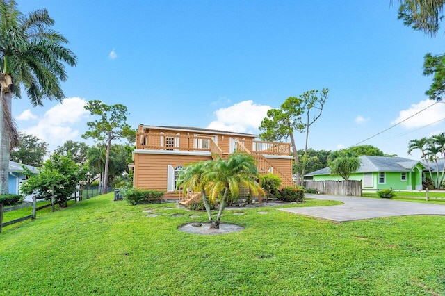 view of front facade with a front yard and a patio