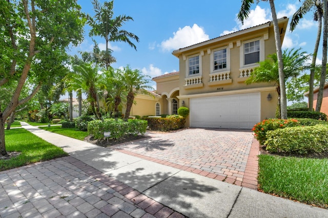 mediterranean / spanish-style home featuring a garage