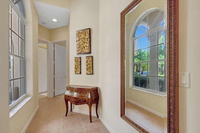 hall with light tile patterned flooring