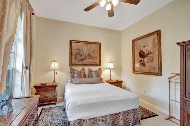 bedroom featuring ceiling fan and light colored carpet