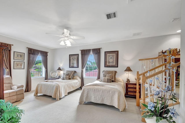 bedroom featuring ceiling fan and light colored carpet