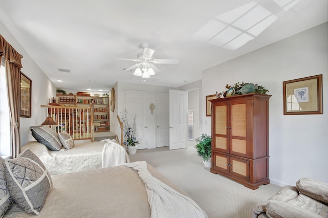 bedroom with light carpet and ceiling fan