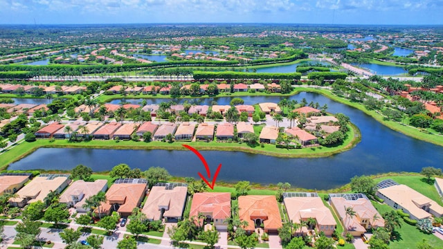 birds eye view of property with a water view