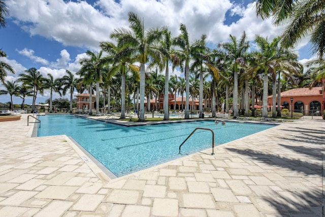 view of swimming pool with a patio