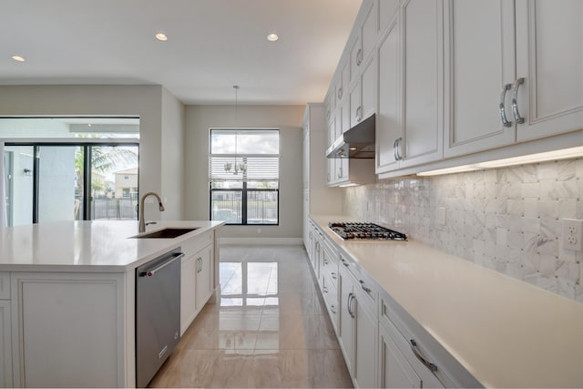 kitchen featuring white cabinetry, sink, an island with sink, and appliances with stainless steel finishes