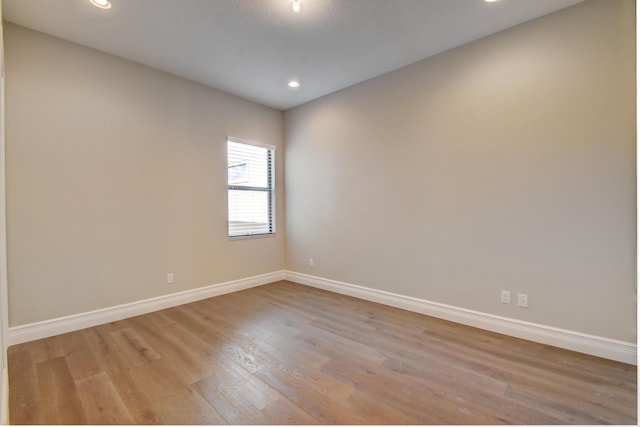 empty room with light hardwood / wood-style floors