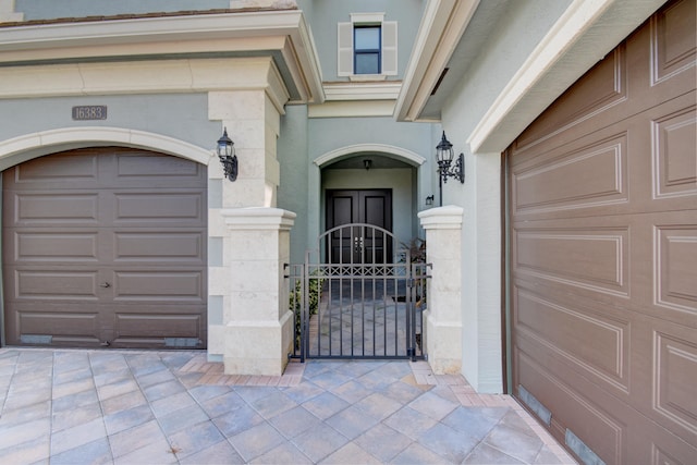 view of exterior entry featuring a garage