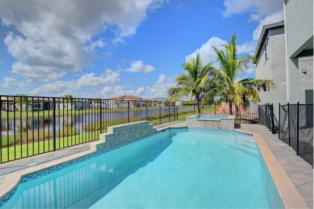 view of pool with an in ground hot tub and a water view