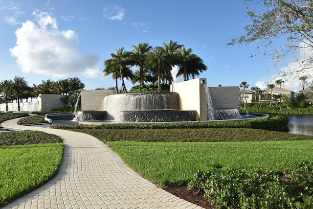 community sign featuring a water view