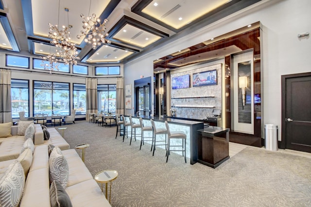 bar with coffered ceiling, light carpet, a notable chandelier, beam ceiling, and a high ceiling