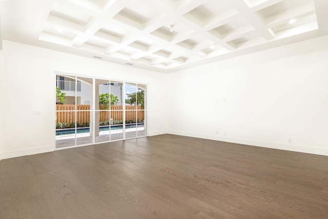 empty room with hardwood / wood-style floors, beamed ceiling, and coffered ceiling