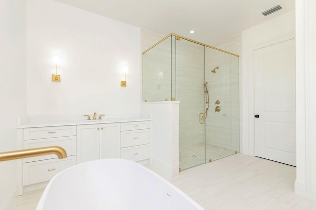 bathroom with vanity, plus walk in shower, and tile patterned floors