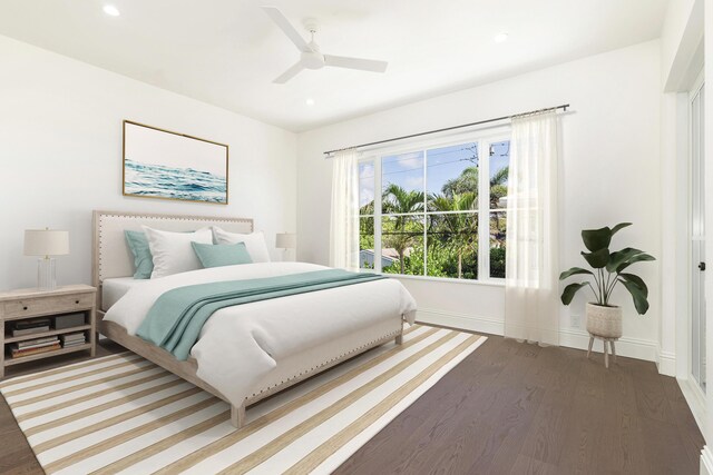 bedroom with wood-type flooring and ceiling fan