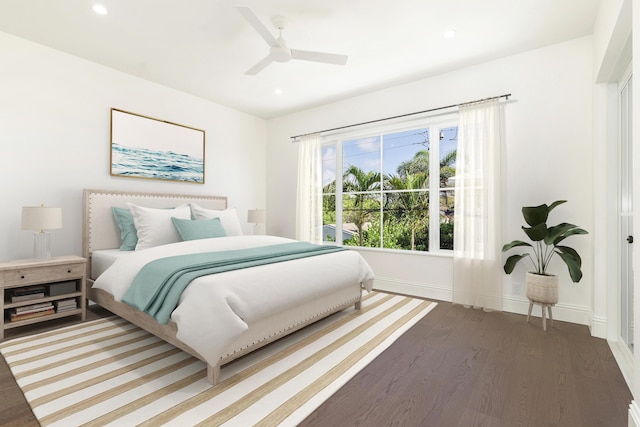 bedroom featuring dark wood-type flooring and ceiling fan