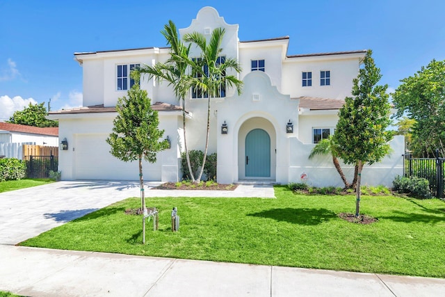 mediterranean / spanish-style house with a garage and a front yard