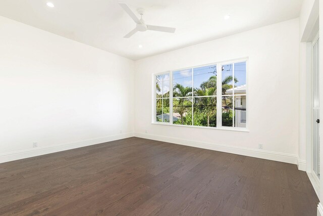 unfurnished room with dark wood-type flooring and ceiling fan