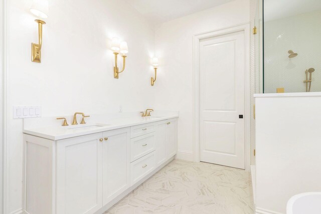 bathroom featuring walk in shower and vanity