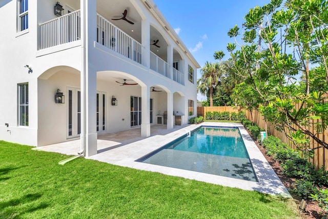 exterior space featuring a patio, a yard, and ceiling fan