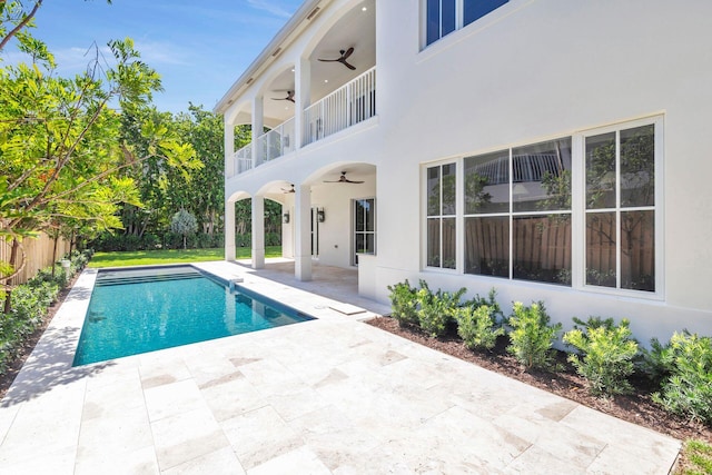 view of pool with a patio area and ceiling fan