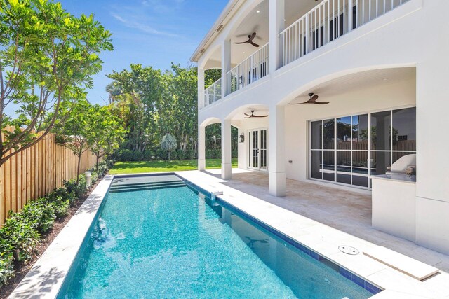 view of pool featuring a patio and ceiling fan