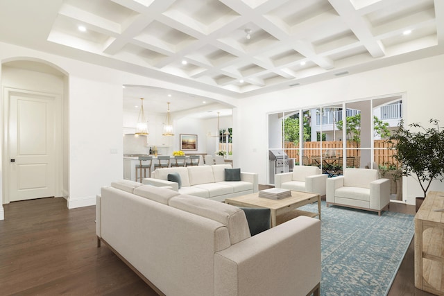 living room with beamed ceiling, coffered ceiling, and dark wood-type flooring