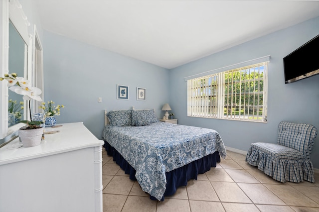 bedroom featuring light tile patterned floors