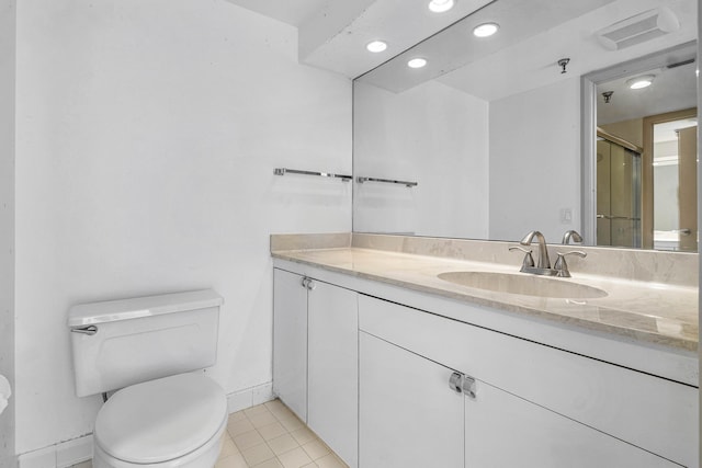 bathroom with tile patterned flooring, toilet, and vanity