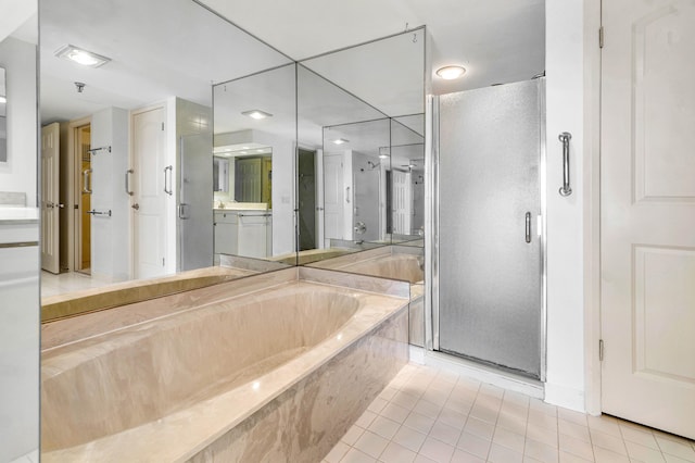 bathroom with vanity, independent shower and bath, and tile patterned flooring