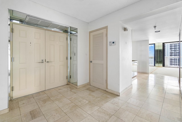 interior space featuring light tile patterned floors