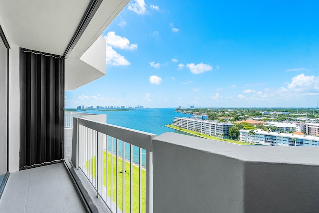 balcony featuring a water view