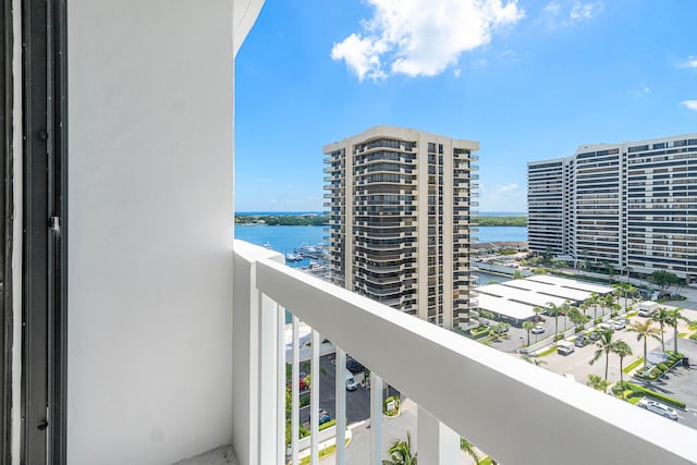 balcony featuring a water view