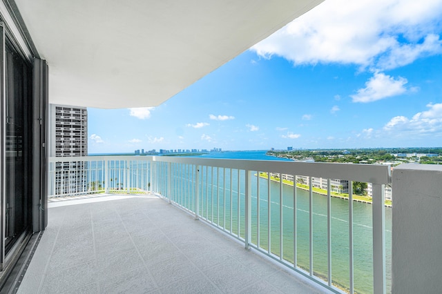 balcony featuring a water view