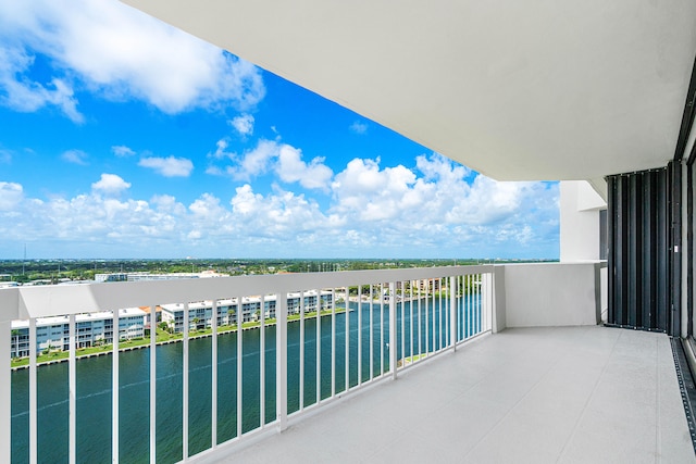 balcony featuring a water view