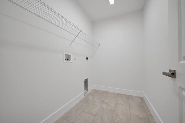 washroom featuring light tile patterned floors, washer hookup, and hookup for an electric dryer