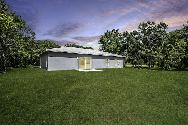 exterior space with a yard