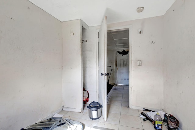 corridor featuring light tile patterned floors