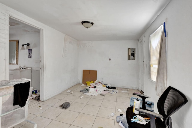 dining area featuring electric panel and light tile patterned floors