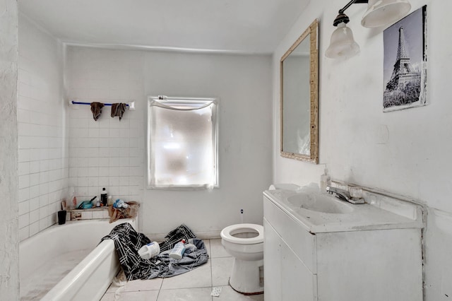 bathroom featuring toilet, tile patterned flooring, a bath, and vanity