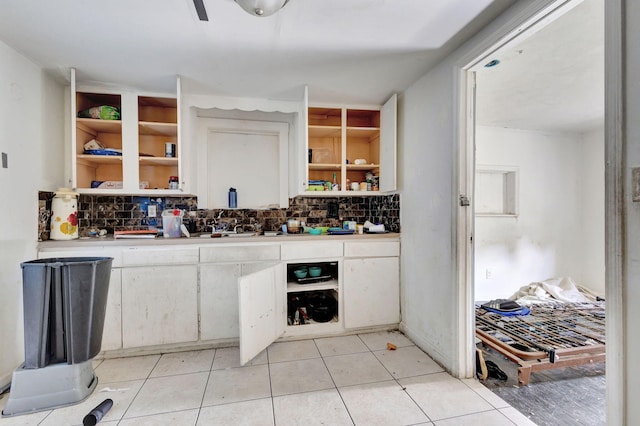 bar featuring tasteful backsplash and light tile patterned flooring