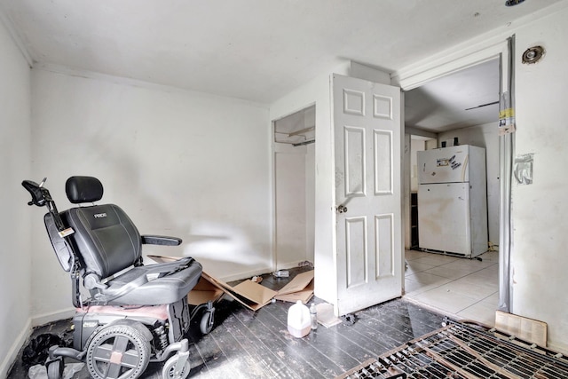 interior space with tile patterned floors and baseboards