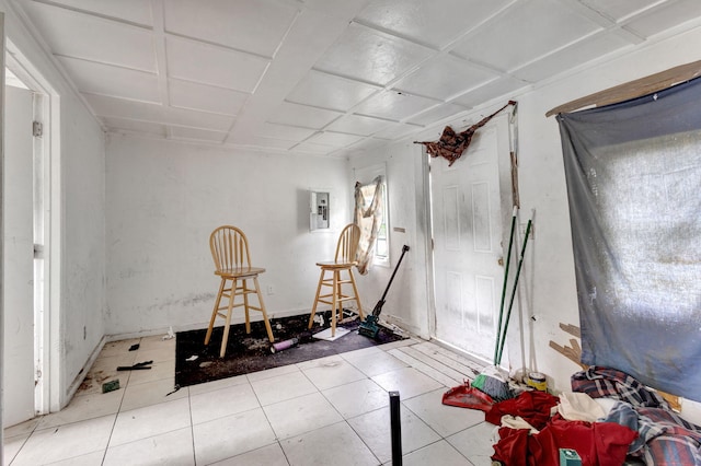 interior space with electric panel and tile patterned floors