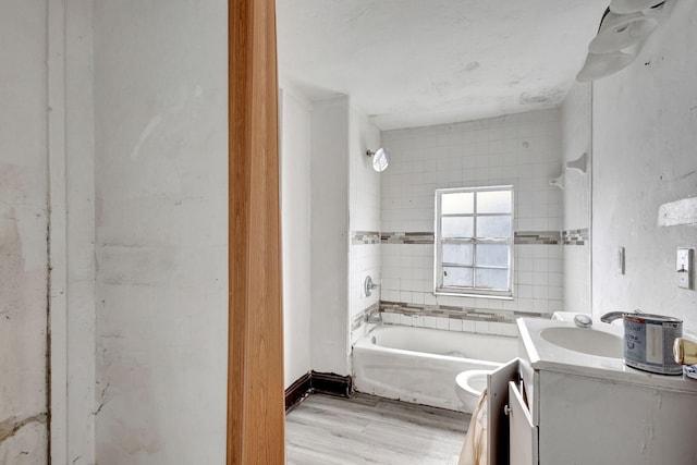 bathroom with toilet, shower / bathtub combination, wood finished floors, and vanity